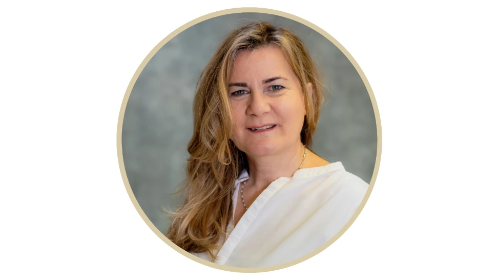 Professional and empathetic female therapist smiling warmly